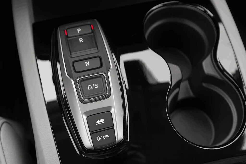 Control buttons on car console featuring climate audio and navigation controls designed for user friendly access Control buttons on car console featuring climate audio and navigation controls designed for user friendly access