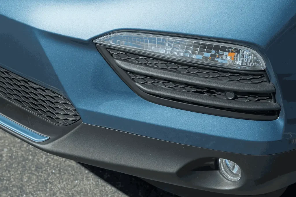 Front grille of a blue 2016 Honda Pilot showcasing bold design modern aesthetics and robust safety features Front grille of a blue 2016 Honda Pilot showcasing bold design modern aesthetics and robust safety features
