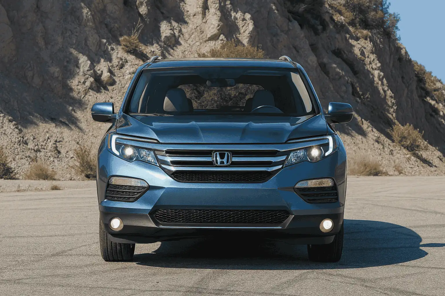 front view of the 2016 honda pilot, showcasing sleek design, spacious grille, advanced safety features, and modern technology