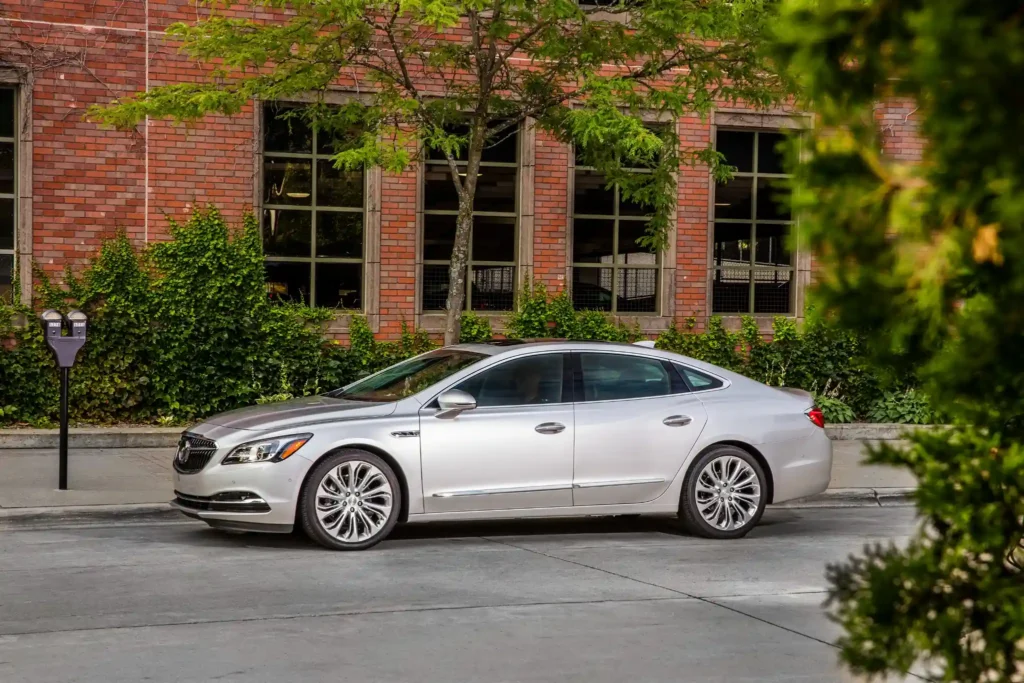 2017 Buick LaCrosse silver luxury sedan side profile parked on city street with alloy wheels 2017 Buick LaCrosse silver luxury sedan side profile parked on city street with alloy wheels