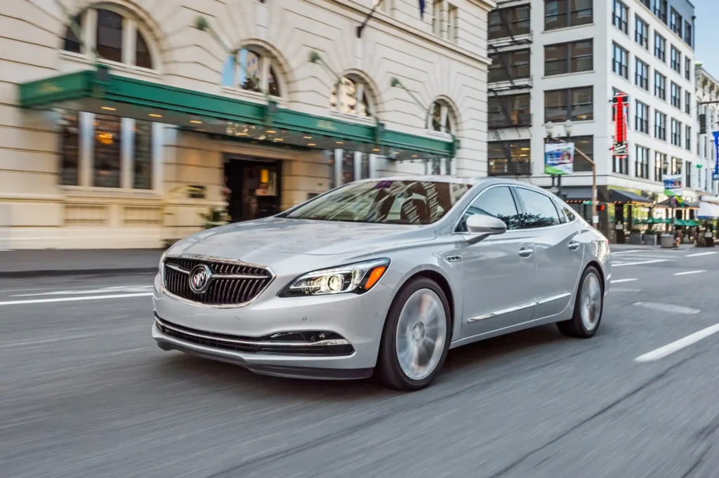 2017 Buick Lacrosse drives down a city street showcasing its sleek side profile and modern design 2017 Buick Lacrosse drives down a city street showcasing its sleek side profile and modern design