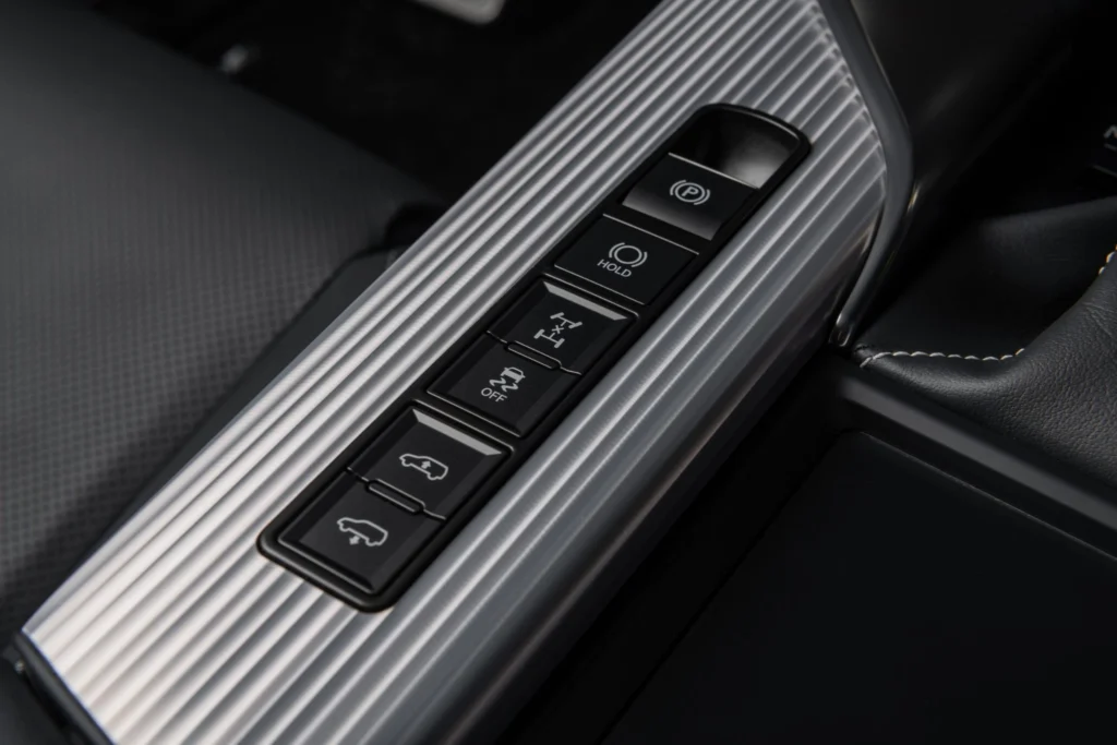 2025 Lexus LX 700h center console showing electronic parking brake traction control and off road assist features 2025 Lexus LX 700h center console showing electronic parking brake traction control and off road assist features