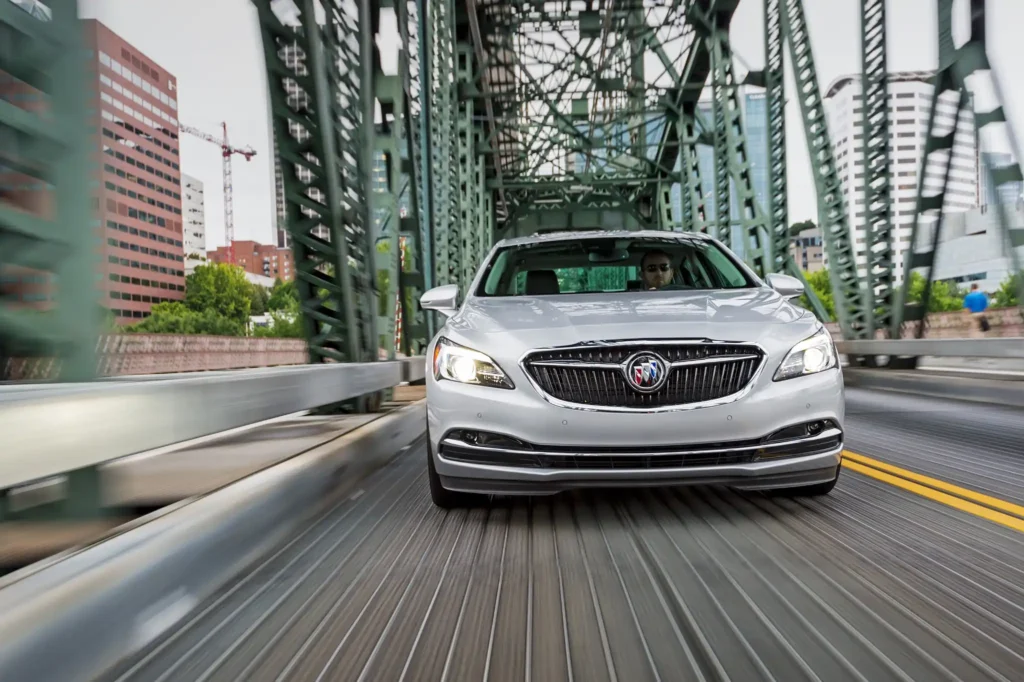 A 2017 Buick Lacrosse drives across a bridge showcasing its sleek side profile and modern design A 2017 Buick Lacrosse drives across a bridge showcasing its sleek side profile and modern design