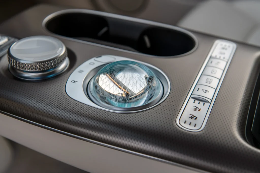 Genesis GV60 crystal gear selector and drive mode controls in center console Genesis GV60 crystal gear selector and drive mode controls in center console