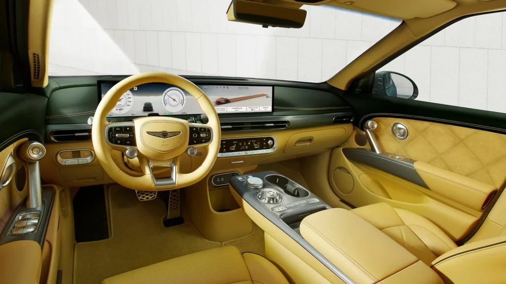 Luxury tan leather interior of Genesis GV60 electric SUV with digital cockpit and premium finishes Luxury tan leather interior of Genesis GV60 electric SUV with digital cockpit and premium finishes