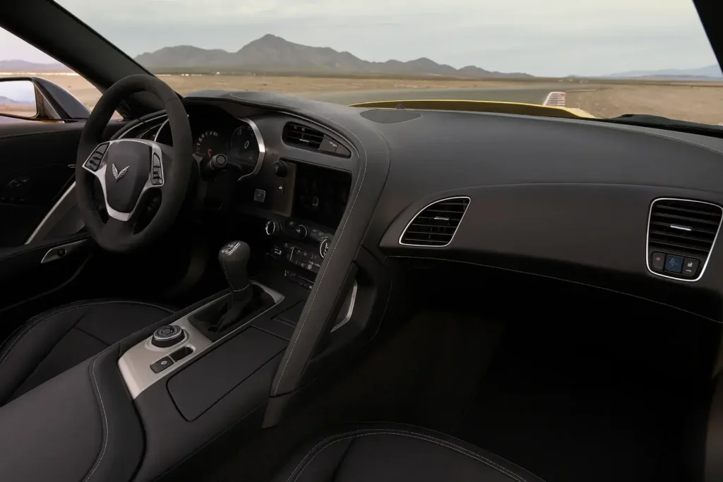 2014 Corvette Stingray Z51 Convertible dashboard in black leather contrast stitching manual gearbox driver focused console facing the track 2014 Corvette Stingray Z51 Convertible dashboard in black leather contrast stitching manual gearbox driver focused console facing the track