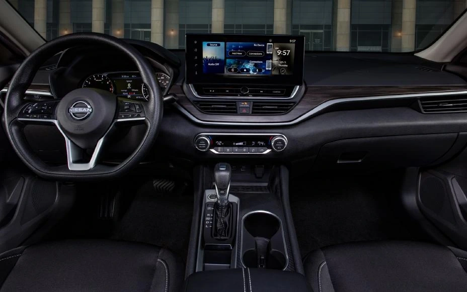 2025 Nissan Altima SR dashboard front view business district backdrop large touchscreen with dual zone climate controls and modern steering wheel 2025 Nissan Altima SR dashboard front view business district backdrop large touchscreen with dual zone climate controls and modern steering wheel
