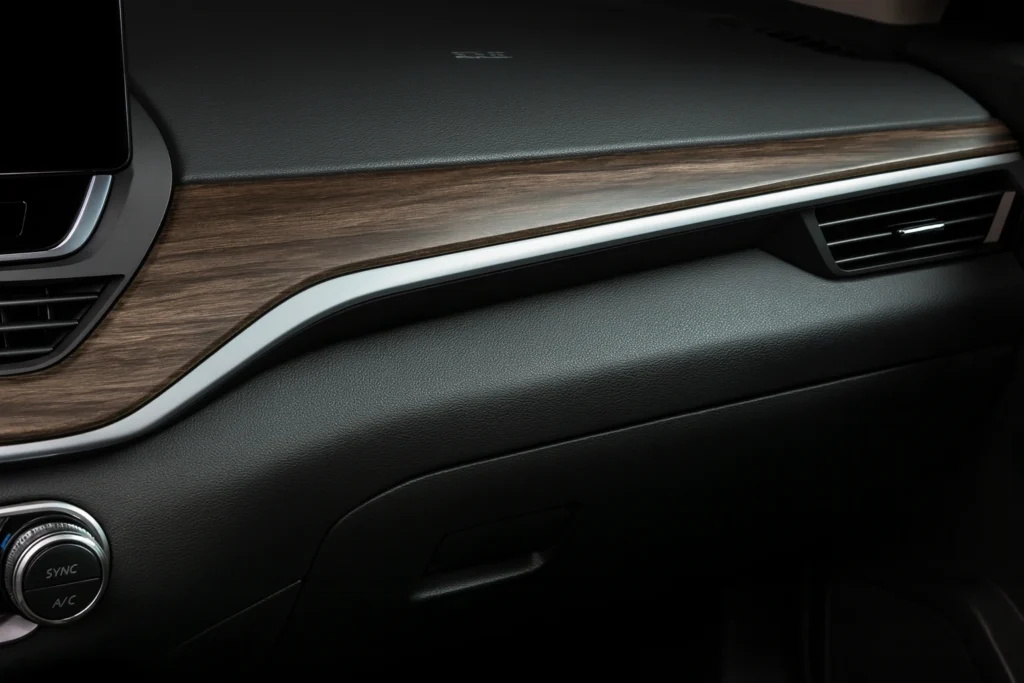 2025 Nissan Altima SR passenger side dashboard close up studio setting textured wood trim and silver accent above right side air vent 2025 Nissan Altima SR passenger side dashboard close up studio setting textured wood trim and silver accent above right side air vent