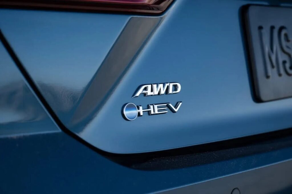 2025 Toyota Camry AWD HEV badge close up on trunk highlighting all wheel drive hybrid capability for confident efficient commuting 2025 Toyota Camry AWD HEV badge close up on trunk highlighting all wheel drive hybrid capability for confident efficient commuting
