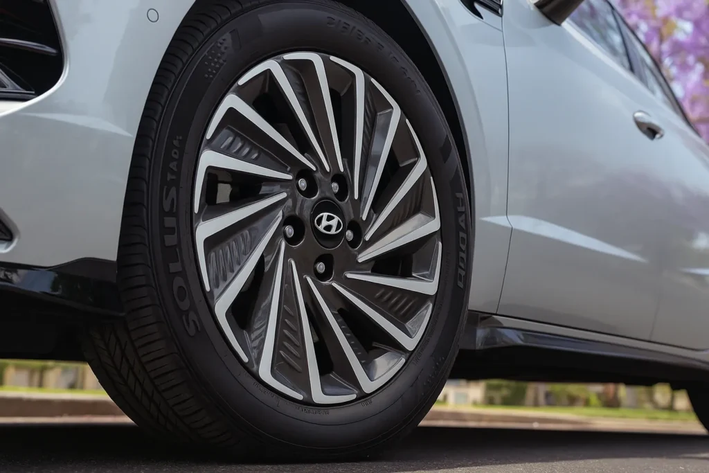 2025 Hyundai Sonata Hybrid wheel close up intricate turbine style alloy design low angle shot highlighting HYBRID tire sidewall detailing 2025 Hyundai Sonata Hybrid wheel close up intricate turbine style alloy design low angle shot highlighting HYBRID tire sidewall detailing