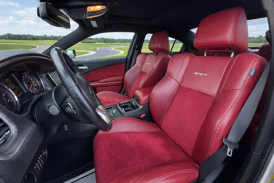 2014 Dodge Charger SRT8 Super Bee driver side interior three quarter view with SRT embroidered seats 2014 Dodge Charger SRT8 Super Bee driver side interior three quarter view with SRT embroidered seats