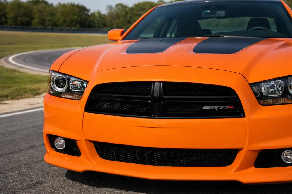 2014 Dodge Charger SRT8 Super Bee front close up of grille and headlights with SRT badge 2014 Dodge Charger SRT8 Super Bee front close up of grille and headlights with SRT badge