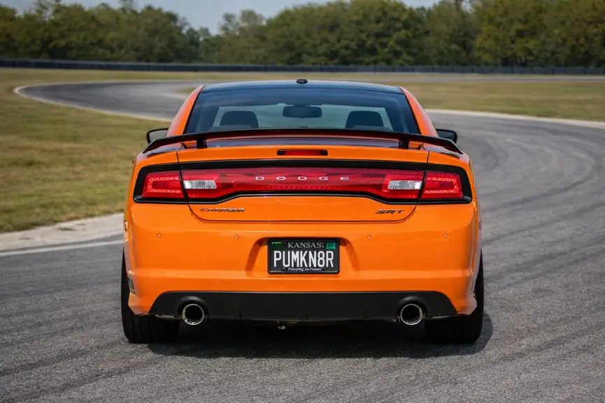 2014 Dodge Charger SRT8 Super Bee rear straight on view with full width taillight on track 2014 Dodge Charger SRT8 Super Bee rear straight on view with full width taillight on track