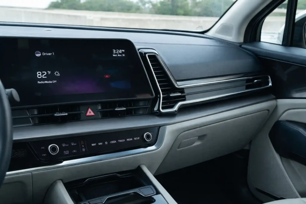 2023 Kia Sportage Plug in Hybrid passenger side dashboard view with wide infotainment screen and center vents 2023 Kia Sportage Plug in Hybrid passenger side dashboard view with wide infotainment screen and center vents