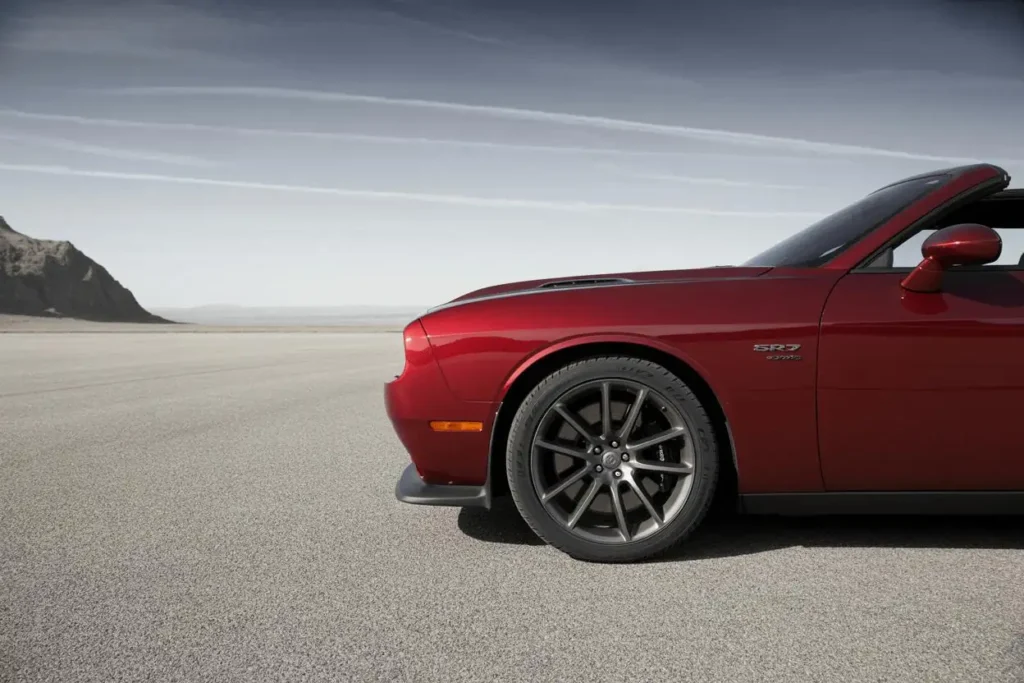 Front quarter view of 2015 Dodge Challenger SRT 392 in red showing SRT fender b Front quarter view of 2015 Dodge Challenger SRT 392 in red showing SRT fender b