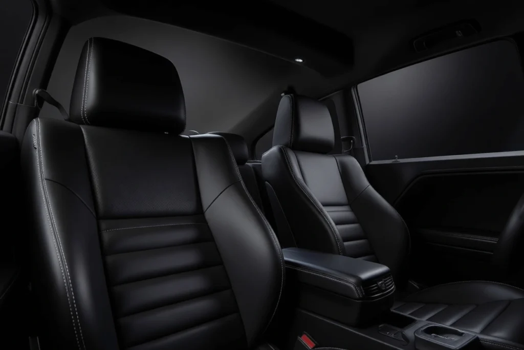 Front seat interior view of 2013 Dodge Challenger RT Plus focusing on bolstered black leather buckets with contrast stitching Front seat interior view of 2013 Dodge Challenger RT Plus focusing on bolstered black leather buckets with contrast stitching