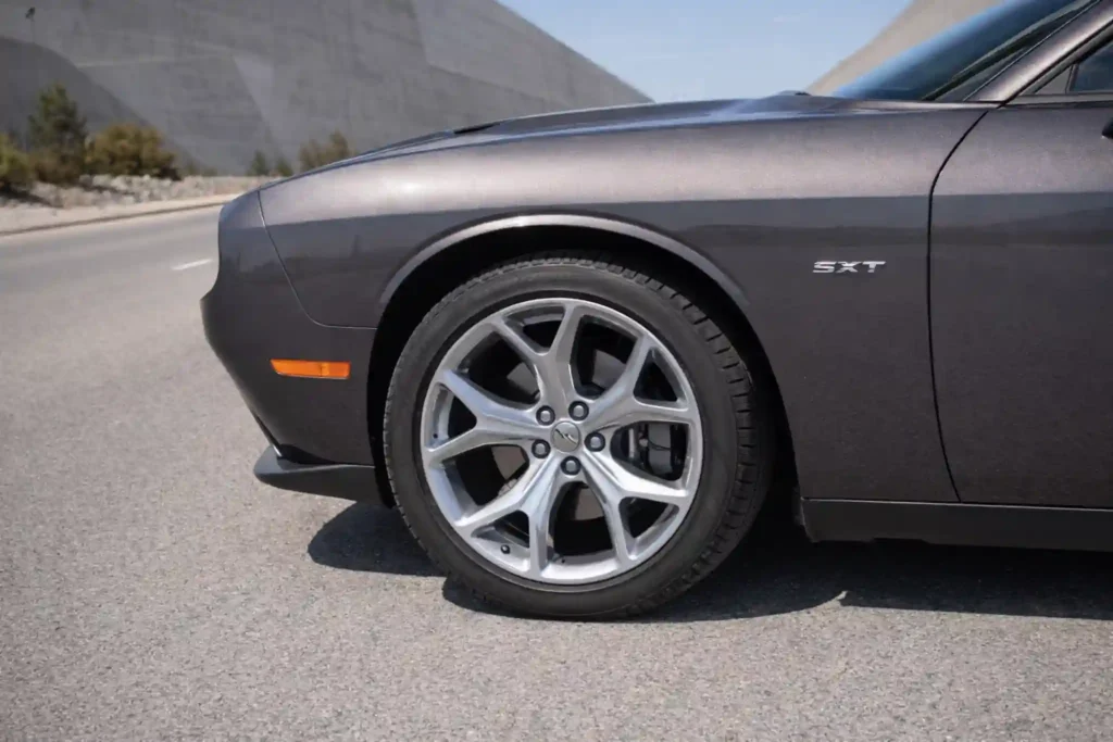 2015 Dodge Challenger SXT Wheel and Fender Close Up with SXT Badge 2015 Dodge Challenger SXT Wheel and Fender Close Up with SXT Badge