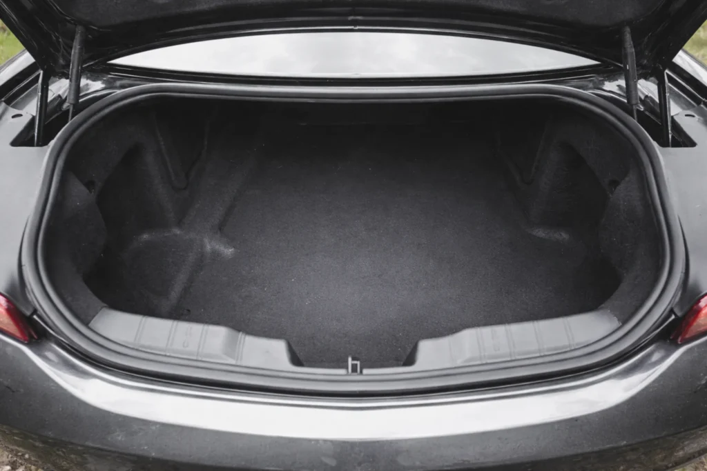2017 chevrolet camaro v6 top down open trunk view showing carpeted cargo area under overcast daylight 2017 chevrolet camaro v6 top down open trunk view showing carpeted cargo area under overcast daylight
